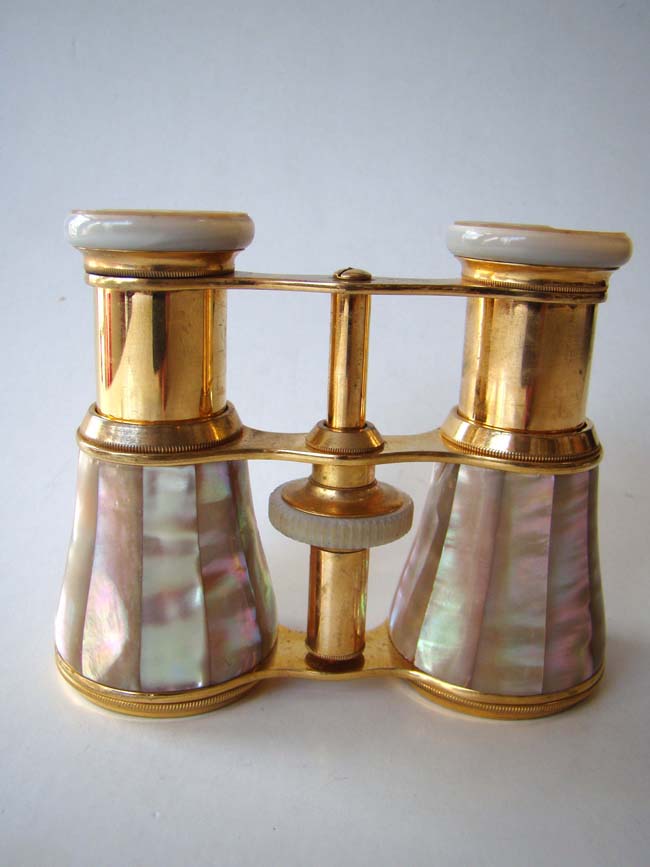 A fine pair of late 19th century French gilt brass Opera Glasses with mother-of-pearl mounts